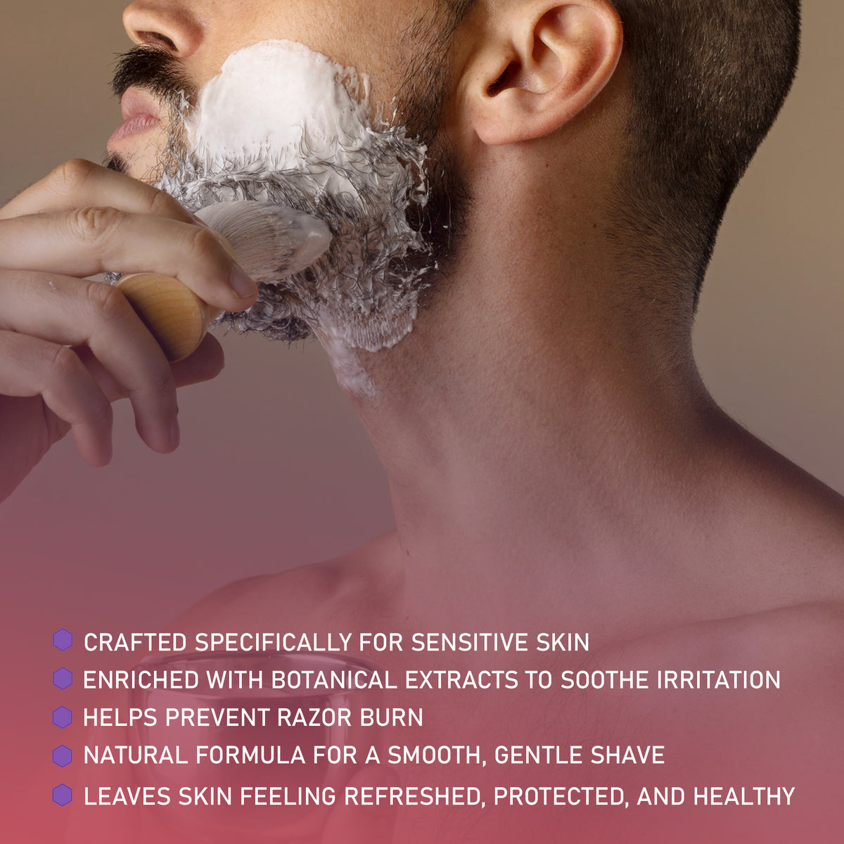 Man shaving with a brush, showing a close-up of the shaving process.